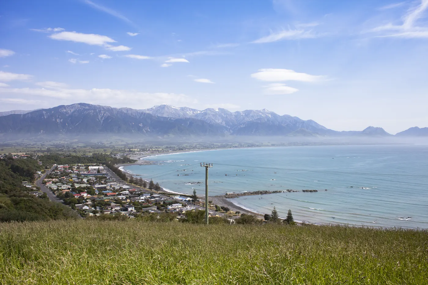 Kaikōura township and bay below the mountains