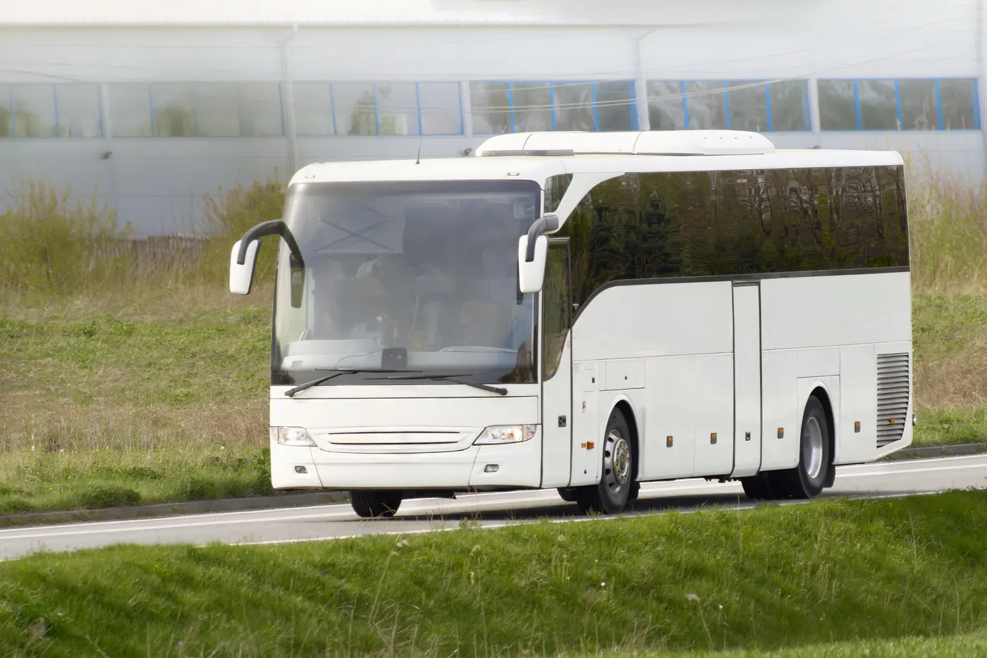 A white coach on a highway