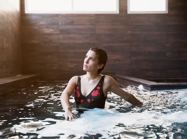 A guest in an indoor spa pool